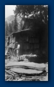 William Clyde Haynes (husband of Josephine Annie McCasland) with pistol at Grandpa Fred Payne McCasland's Northern California Cabin